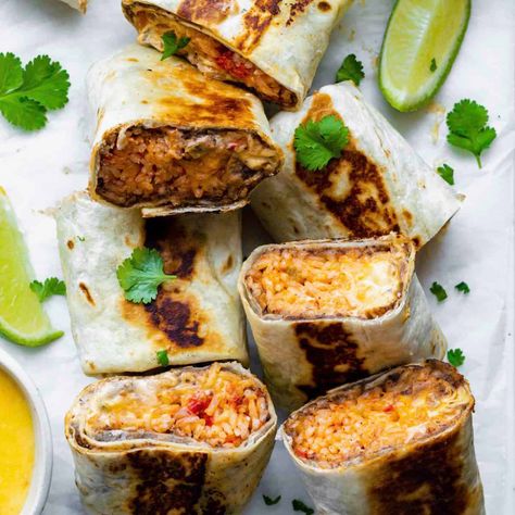 Cheesy Bean and Rice Burritos Recipe Cheesy Bean And Rice Burrito, Bean And Rice Burrito, Rice And Bean Burrito, Burrito Ingredients, Rice Burrito, Bean And Rice, Tofu Scramble Vegan, Bean Burrito, Bean Rice