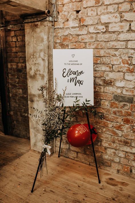 Monochrome wedding welcome sign on black easel with dried florals and red balloons with gold Chinese motif. Easel With Balloons, Wedding Dress Sage Green, Sage Green Satin Bridesmaid Dresses, Green Satin Bridesmaid, Green Satin Bridesmaid Dresses, Rustic Wedding Signage, Family Style Weddings, Black Easel, Monochrome Wedding