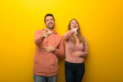 In valentine day group of two people on yellow background pointing with finger at someone and laughing a lot Premium Photo Laughing Images, Laughing Pictures, Laugh Cartoon, Friday Meme, Walmart Funny, Funny Friday Memes, Laugh Meme, Laughing Face, Laughing Emoji