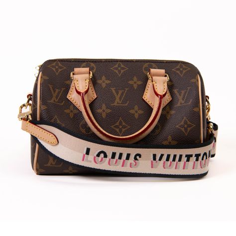 100% Authentic This adorable Louis Vuitton Monogram Canvas Speedy 20 Bag is the perfect city bag. While retaining its iconic shape, the Speedy 20 has acquired new details like the fashionable wide, canvas strap with a wove Louis Vuitton signature. The bag has the classic shape and design and a bright red interior. The classic Monogram Canvas has been Louis Vuitton's trademark design since it was first introduced in 1896. The graphic symbols, including the quatrefoils and flowers, as well as the French Tote Bag, Graphic Symbols, Trademark Design, Speedy Bandouliere, Classic Monogram, Red Interior, Lv Monogram, Classic Bags, City Bag