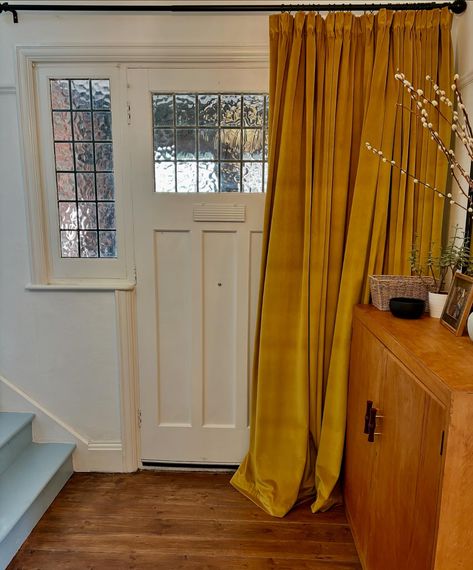 As the cooler months approach, I’m a big fan of a cosy door curtain to keep the warmth in. This one provides a pop of rich colour to what could have been a gloomy space. 📷: @stephcookinteriors #curtains #doorcurtain Curtains For Arched Doorway, Curtain Over Front Door, Curtain Over Door, Curtains Over French Doors, Curtains Over Front Door, Doorway Curtain Ideas, Hallway Curtains, Fromt Doors, Tranquil Spaces