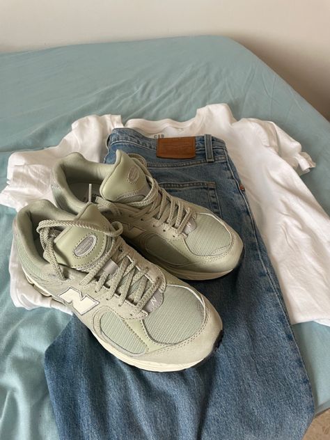 Travel capsule wardrobe inspo. Levis jeans, white tshirt, and sage green New Balance 2002r - the best travel shoes Sage Green Capsule Wardrobe, Sage Shoes Outfit, New Balance 2002r Women, Sage Green Shoes, Best Travel Shoes, Green New Balance, New Balance Outfit, Thrift Inspo, New Balance 2002r