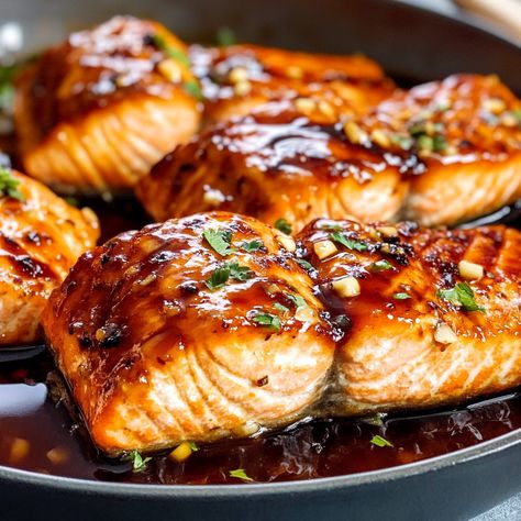 This Honey Garlic Glazed Salmon recipe is a must-try for a quick and delicious dinner. Succulent salmon filets are coated in a rich honey garlic glaze, blending sweet and savory flavors for a perfect caramelized Sweet Sauce For Salmon, Salmon Recipes On Stove Top, Salmon With Honey Glaze, Teriyaki Salmon Recipes, Coho Salmon Recipes, Honey Dijon Salmon, Honey Garlic Glazed Salmon, Salmon On The Stove, Bbq Salmon Recipes