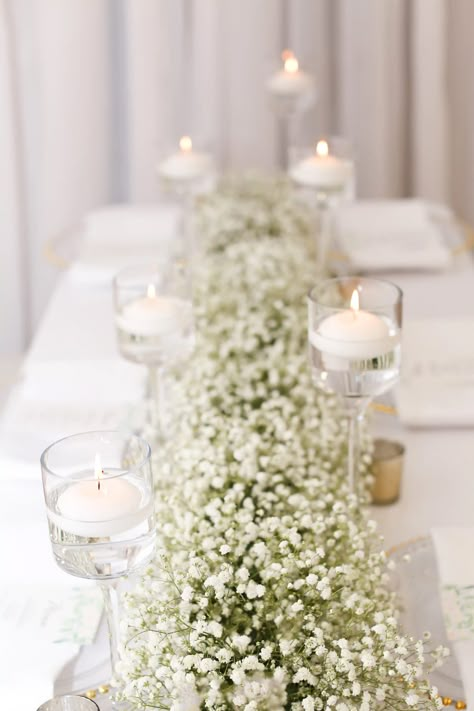 baby's breath flower runner garland floating candles head table bridal table White Roses Head Table, Babysbreath Centerpieces Long Table, Floating Candle Centerpieces Long Table, White Theme Engagement Party, Gypsophila Table Runner, Wedding Rectangle Table Centerpieces, Baby's Breath Table Runner, Baby’s Breath Table Runner, Baby Breath Table Runner