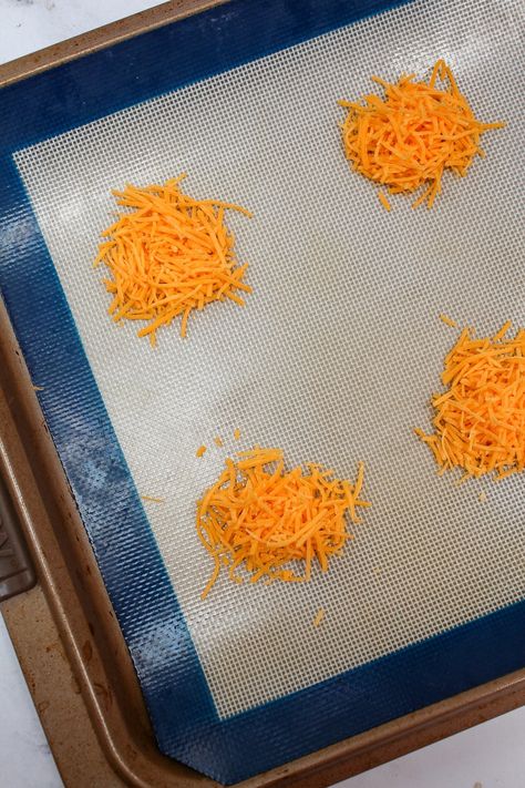 Melted Cheese Crisps, Crispy Cheese Wafers, Keto Cheddar Crackers, How To Make Cheese Crisps In The Oven, Shredded Cheese Crisps, Baked Cheese Snacks, Homemade Cheese Whisps, Shredded Cheddar Cheese Recipes, Cheddar Cheese Crackers