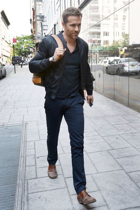 The Week in Style: 07.10.15 | GQ Ryan Reynolds casual Friday, navy monochrome, black leather bomber jacket, pants, Henley, backpack brown shoes Black Henley Outfit Men, Black Pants Brown Shoes, Ryan Reynolds Style, Mens Style Guide, Brown Shoes, Ryan Reynolds, Casual Friday, Brown Shoe, Leather Jacket Men