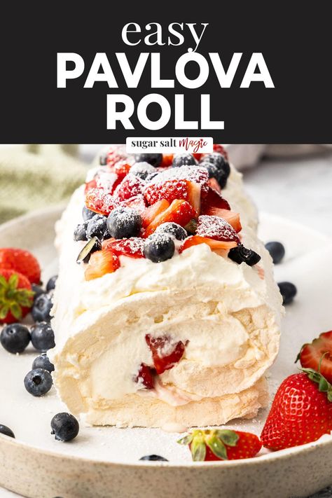 This pavlova roll, aka meringue roulade, is a great twist on the traditional pavlova. Cloud-like meringue and whipped cream studded with fresh berries. Pavlova Roulade, Pavlova Roll, Eton Mess Dessert, Easy Meringues, Meringue Roulade, Roulade Recipe, Berry Coulis, Pavlova Dessert, Weekend Recipes