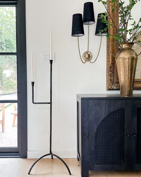 Floor candelabra, wall sconces, and black sideboard! living room decor, home decor, home design, Home accents, cozy home, warm home aesthetic Black Sideboard Living Room, Sideboard Living Room, Warm Home Aesthetic, Floor Candelabra, Black Sideboard, Warm Home, Black Iron, Cozy Living Rooms, Cozy Living