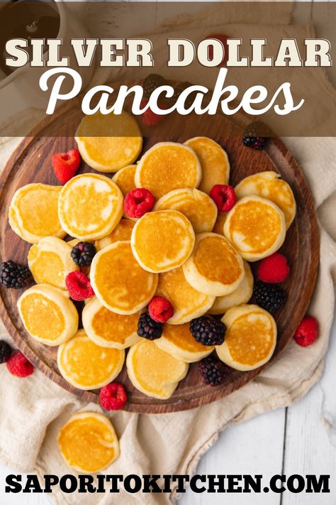 Wooden round board with multiple pancakes and fresh fruit. Homemade Pancakes Without Baking Powder, Diy Pancake Mix Easy Just Add Water, Dennys Pancakes, Denny's Cinnamon Roll Pancakes, Super Fluffy Pancakes, Silver Dollar Pancakes, Freeze Pancakes, Pancake Calories, Pancake Toppings