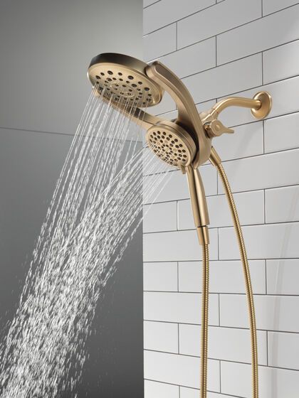 HydroRain® 4-Setting Two-in-One Shower Head in Champagne Bronze 75698DCZ | Delta Faucet Bronze Hardware Bathroom, Brushed Nickel And Gold Bathroom, Delta Champagne Bronze, Champagne Bronze Hardware, Gold Shower, High Pressure Shower Head, Luxurious Showers, Plumbing Installation, Shower Fixtures