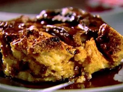 Panettone Bread Pudding with Cinnamon Syrup Recipe | Giada De Laurentiis | Food Network Cinnamon Syrup Recipe, Amaretto Sauce, Panettone Bread Pudding, Cinnamon Bread Pudding, Bourbon Butter, Panettone Bread, Joanna Gaines Recipes, Cinnamon Syrup, Yorkshire Pudding