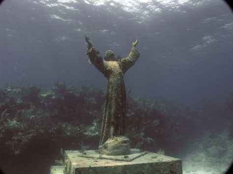 The statue "The Christ of Abyss" is a submerged bronze statue of Jesus Christ, located in the Mediterranean Sea off San Fruttuoso between Camogli and Portofino on the Italian Riviera. Description from pinterest.com. I searched for this on bing.com/images Christ Of The Abyss, Spooky Places, Italian Riviera, Travel Around Europe, Places In Italy, The Abyss, Jesus Christ Images, Religious Symbols, City Architecture