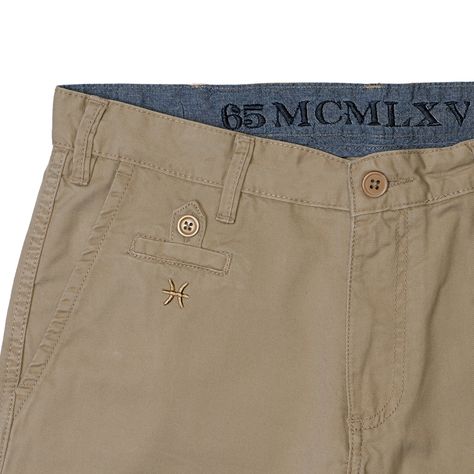 Get comfortable and noticed in our signature men's chino short. Classic straight fit with sharp detailing. Khaki color. Our khaki chino short is available in waist sizes 30/32/33/34/36/38. Refer to our Size Guide. Imported. The perfect fitting shorts to keep you cool at the office or on your day off. #65mcmlxvChinoShort Features - Contrast chambray inside waistband with logo embroidery - Logo embroidery below front coin pocket - Flat front - Zip fly closure; belt loops - Rear welt pockets with b Menswear Details, Khaki Shorts Men, Trousers Details, Trouser Design, Mens Shorts Summer, Men Trousers, Mens Chinos, Mens Khakis, Chino Pants