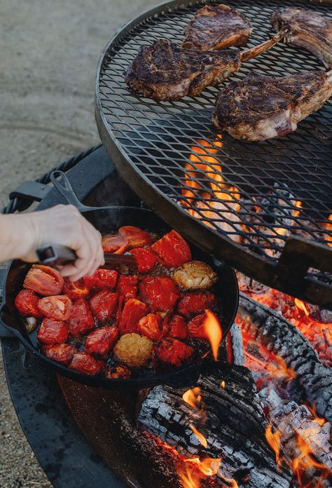 This year, get outside and get cooking with the Kettle-style Fire Pit. From grilling juicy cuts of meat to sizzling fresh veggies with your Side Kick, there’s endless possibilities to play around with new recipes and cooking methods over the fire. Delicious outdoor cooking awaits! Find your new outdoor cooking setup today at seaislandforge.com #SeaIslandForge #SeaIslandForgeLife #SIFKettle #OutdoorFirePit #OutdoorCooking #ByTheFire #ForgeCooking #HandForged #OpenFireCooking #Grilling Outside Cooking, Pit Cooking, Over The Fire Cooking, Fire Pit Cooking, Open Fire Cooking, Side Kick, Fire Pit Grill, Fire Cooking, Open Fire