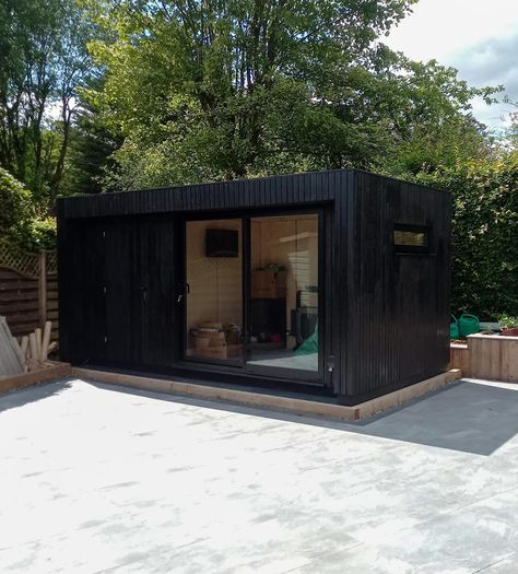 Yakisugi is the Japanese process of charring timber to create this deep black and sustainable cladding option. It adds sustainability, longevity and charm. It’s one of our most popular cladding options and it really looks great on our OKOPOD garden rooms. Contact us for more information info@okopod.com #yakisugi #extension #homeextension #gardenroom #gardenoffice #gardenpod #gardenretreat #gardenstudio #gardenhangout #homeoffice #office #wfh #workfromhome #prefab #annexe #annex #tinyhome #... Black Garden Room, Garden Office Shed, Black Shed, Exterior Garden, Office Shed, Garden Pods, Charm It, Black Garden, Garden Rooms