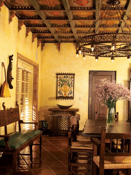 Decorative ceiling, chandelier & sunny warm colors, terracotta floors & decorative accessories create a sophisticated welcoming space Terracotta Floors, Spanish Hacienda, Mexican Hacienda, Spanish Decor, Spanish Tiles, Mexican Home Decor, Casa Country, Mexican Home, Spanish Style Home