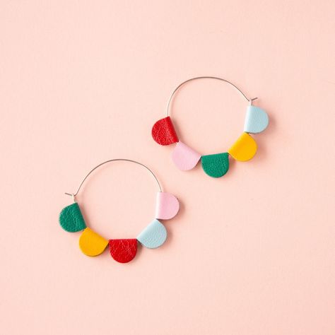 DAISY Petal Hoops, made from reclaimed leather. This listing is for the RAINBOW pair. We've also got them in 7 different solid colour options: https://www.etsy.com/listing/1434618692 The size of the actual hoops is 3.5cm x 3.5 ... with the petals, the width is 5 cm. FEATURES * * * * Made from lightweight leather, salvaged from second hand clothing + scraps * The long hoops are Surgical Stainless Steel * The hoops are latch back - a little post fits into a loop CONSTRUCTION / DESIGN * * * Each pi Rainbow Daisy, Craft Earrings, Y2k Nostalgia, Colourful Earrings, Daisy Petals, Big Hoop Earrings, Construction Design, Colorful Earrings, Recycled Leather