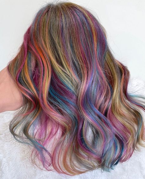 Multi Colour Hair Highlights, Brunette With Rainbow Highlights, Curly Hair Rainbow Highlights, Rainbow Hair Balayage, Multi Dimensional Dramatic Hair, Pastel Highlights In Brown Hair, Prism Highlights Hair, Dramatic Multi Dimensional Hair Color, Rainbow Babylights Hair