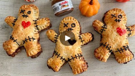 4.4M views · 32K reactions | Nutella Halloween Voodoo Dolls 😍 | Nutella Stuffed Pastry Voodoo Dolls 😍

I think these are just so cute 😂 They’re crisp, buttery, and filled Nutella 💕 They’re so quick and easy to make... | By Fitwaffle | Let's make super easy Nutella
Stuffed Pastry Voodoo Dolls for halloween. Grab some ready roll
puff pastry or make your own. It's totally up to you. Then
spread Nutella over half a bit. Fold it in half and press it
down gently. Then cut out your shape. Mine were pretty big so
I only got four. Fill the edges with a fork. Then cut out a
little heart with a knife. This is totally optional by the way.
I just say it looks really cute. Make your egg wash then
brush it over the top to make them golden brown. Then give
them a sprinkle of sugar and bake until puff Stuffed Pastry, Halloween Ideias, Desserts Halloween, Nutella Spread, Halloween Desserts, Voodoo Dolls, Egg Wash, Pie Plate, Halloween Recipes