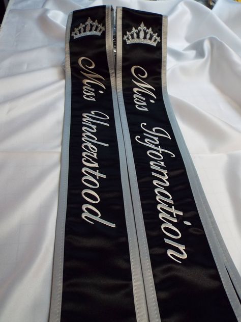 Pageant sash / Black satin and white satin / Dark gray trim and thread / script font and Daily font / Silver Metallic Crowns on shoulder Optional /  If you would like to add a name on the back there is a added fee of $14.00 to add first and last name  Please contact us before you place your order ...thank you  theses' sashes or custom made to order for your / Drill Team / Schools / Bands / Clubs / events /  Pageant shows/and much much  more Remember the more lettering you put on the sash will de Sash Design Ideas Pageant, Sash For Pageant, Prom Sash, Sash Ideas, Sash Design, Pageant Sashes, Pageant Life, Famous Lifestyle, White Sash