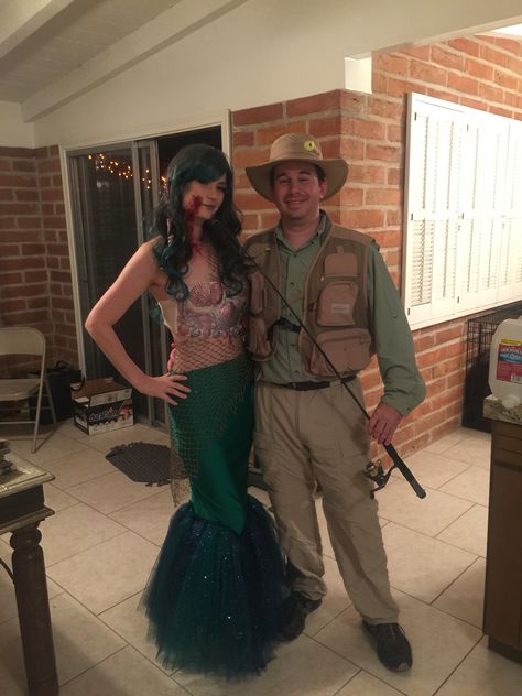 Couple mermaid and fisherman Halloween costumes Couple Halloween Costumes Mermaid, Fisherman And Mermaid Costume, Fish And Fisherman Couples Costume, Mermaid And Fisherman Costume, Mermaid And Fisherman, Fisherman Costume, Diy Halloween Props, Halloween Customer, Halloween Costumes Diy