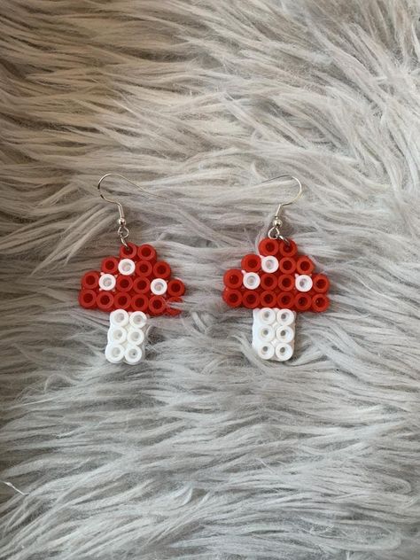 mushroom pearler/fuse beads earrings  note ;  i do work alone. keep in mind each of these are made from hand and do take a while depending on design. not all of them will look exactly the same all the time. Earring Perler Beads, Fuse Beads Earrings, Fuze Beads Ideas, Earrings Perler Beads, Perler Bead Designs, Melty Bead Designs, Easy Perler Beads Ideas, Art Perle, Pony Bead Patterns