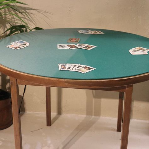 Vintage Folding Round Card Table / Felt Top Table / Poker Table / Jigsaw Table A lovely vintage round card table, with a green felt top. The legs fold underneath for storage. Perfect for card games, poker, bridge, etc. Or for jigsaws, puzzles.  In good condition. The felt top does have fade marks - please see photos for the best description. Please note playing cards and other items in the photos are not included.  DIMENSIONS  101cm diameter 74cm high  70cm high (from floor to underside of table Round Game Table And Chairs, Table Poker, Game Table And Chairs, Jigsaw Table, Card Game Table, Island Party, Dorm Design, Cards Table, Foldable Card