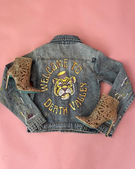 Make a statement with the Vintage Tiger Hand Painted Denim Jacket. This unique piece features hand-painted detailing, sparkling glitter accents, and small rhinestone detail. #geauxtigers🐯 #lsudenim #lsujacket #deathvalley #gameday Tap to shop Denim Rhinestone, Vintage Tiger, Demin Jacket, Hand Painted Denim Jacket, Painted Denim Jacket, One Piece & Sets, Wedding Guest Style, Maxi Gown Dress, Painted Denim