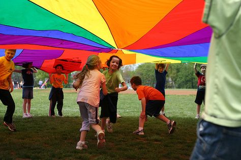 Rainbow Parachute (Favorite P.E. Activity) Rainbow Party Games, Rainbow Parachute, Parachute Games, Hunger Games Party, Childhood Aesthetic, Farm Preschool, Gym Classes, Play Gym, School Games