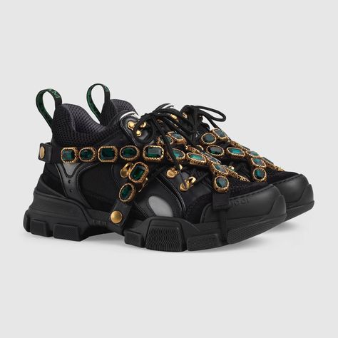 Shop the Flashtrek sneaker with removable crystals by Gucci. Green crystals are embroidered onto a removable elastic strap, wrapping around these sneakers. Inspired by the hiking world, this shoe line combines an oversize design with dream-like details. Featuring a dynamic mix of materials – rubber, suede, and technical canvas – the accessory is defined by the Gucci patch with the graphic font of SEGA, a fixture in the colorful arcades and coin-op game rooms of the '80s. Gucci Crystal Sneakers, Gucci Flashtrek, Sneakers Gucci, Gucci Collection, Lanvin Sneakers, Dior Sneakers, Gucci Gifts, Balenciaga Sneakers, Gucci Sneakers