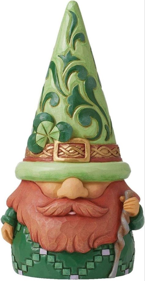 No one knows gnomes quite like Jim Shore! This Irish gnome is the newest addition in the ever expanding collection of the large hat wearing guardians. Donning a red beard, this gnome carried a staff and wears a clover in his hat for luck. #leprechaun #stpatricksdaydecor #stpattysday #stpatricksdaytraditions #irish #gnomes Holding Staff, Irish Gnome, Large Hat, Irish Leprechaun, Red Beard, Large Hats, Jim Shore, Holding Flowers, St Pattys Day