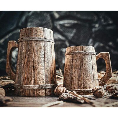 Every Viking tankard is made from planks of mango wood, an extremely durable timber, comes sealed with food-safe lacquer. The same sealant is used on wooden salad bowls and spoons. Plus, with the antique grain of the wood, no two tankards look exactly alike. It's time that you chose a drinking vessel as interesting as you! Capacity: 16 Oz. | SpicyMedia Norse Tradesman 100% Handcrafted Ale Tankard Teak Wood Bear Mug in Brown, Size 16 Oz | Wayfair Wooden Beer Mug, Wooden Salad Bowl, Food Safe Epoxy, Drinking Vessels, Wooden Barrel, Beer Taps, Viking Style, Beer Mugs, Animal Companions