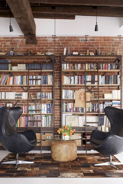 Home library with brick wall backdrop and comfy modern decor Home Library Design Ideas, Modern Industrial Loft, Home Library Decor, Brick Wall Backdrop, Home Library Rooms, Home Library Design, Industrial Interior Design, Industrial Interiors, Home Libraries