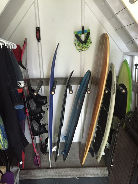 Surf board storage Kayak Storage Boat House, Lakehouse Storage Shed, Water Ski Storage Ideas, Lake Shed Organization, Boat Dock Storage Closet Ideas, Water Ski Storage, Boathouse Storage Ideas, Life Jacket Storage Ideas, Lake Barndominium