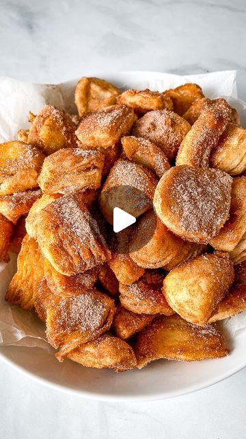 Cook Fast, Eat Well on Instagram: "Easy Biscuit Bites Recipe ⬇️⁣
These taste like doughnut holes!⁣
⁣
For the Biscuit Bites⁣
1 can flaky biscuits (16.3 ounces)⁣
⁣
For Cinnamon Sugar Bites⁣
½ stick butter, melted (2 ounces; 56 grams)⁣
½ cup cinnamon sugar (3 1/2 ounces; 100 grams)⁣
⁣
For Glazed Bites⁣
1 cup powdered sugar (4 ounces; 113 grams)⁣
½ teaspoon ground cinnamon⁣
1 tablespoon honey⁣
1 tablespoon butter, melted⁣
2 tablespoons milk, plus more as needed⁣
⁣
Bake the Biscuit Bites⁣
Preheat oven to 350°F. Line a baking sheet with parchment paper.⁣
⁣
Open biscuit can and separate biscuits. Cut each biscuit into four pieces. Roll each piece into a ball and place onto the prepared baking sheet.⁣
⁣
Bake until biscuits are golden brown, about 15 minutes. They spread during baking and don’t sta Cinnamon Sugar Bites, Biscuit Cinnamon Rolls, Biscuit Bites, Puff Pastry Shells, Easy Biscuit, Sugar Biscuits, Doughnut Holes, Pillsbury Recipes, Flaky Biscuits