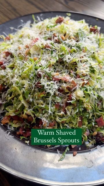 Ereka Vetrini on Instagram: "If you don’t like Brussels sprouts, I ask that you give my WARM BRUSSELS SPROUTS SALAD a try! Shaved Brussels sprouts tossed in bacon fat + grated Parmigiano Reggiano hits different! Note: if you are using a food processor be sure to use the grater attachment Ingredients: ⅓ cup pignoli nuts or sliced almonds 1 ½ lbs of Brussels sprouts rinsed & shredded 3 to 4 large pieces of thick cut bacon ¾ tsp salt ½ tsp pepper 3 tbsp olive oil ¾ cup freshly grated parmigiano reggiano or pecorino Romano ½ cup pitted dates chopped or raisins -Add pignoli nuts to a non-stick pan, turn heat to medium-high and toast until golden brown on both sides. -Add bacon to a large skillet and cook over medium heat. Cook until fat has rendered and bacon is crispy. -Remove the bacon a Warm Brussel Sprout Salad, Shaved Brussel Sprout Salad, Shaved Brussel Sprouts, Brussels Sprouts Salad, Pitted Dates, Bacon Brussel Sprouts, Shredded Brussel Sprouts, Pecorino Romano, Sprouts Salad