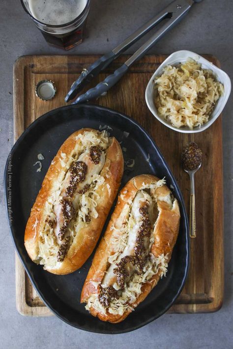 Beer Braised Sauerkraut and Bratwurst | Craft Beering Braised Sauerkraut, Cooking Sauerkraut, German Cusine, Oktoberfest Appetizer, Oktoberfest Menu, Beer Bratwurst, Traditional German Food, Fermented Sauerkraut, Braised Red Cabbage