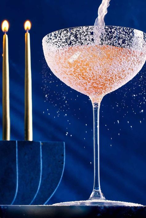 Naomi Levy’s Hebrew Hammer is a fruity, bright pink Hanukkah cocktail that uses framboise to mimic the flavors of sufganiyot, Israeli doughnuts. #cocktails#cocktailrecipes#drinks#drinkideas#drinkrecipes#drinkalcoholrecipes #holidayrecipes #holidaycocktails #hanukkahcocktails #vodkacocktails Hanukkah Cocktails, Chanukah Cocktails, Christmas Themed Cocktails, Fig Syrup, Simple Syrup Cocktails, Whiskey Smash, Clear Fruit, Jelly Doughnuts, Hanukkah Party