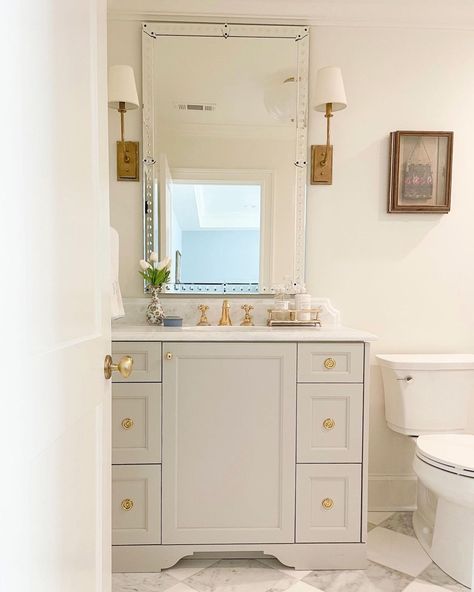 Ferrill Sessions Designs on Instagram: “Completed bathroom! A toe kick detail never disappoints. • • • #ferrillsessionsdesigns #bathroomdesign #bathroomvanity #brassbathroom…” Gray Bathroom Vanity With Gold Hardware, Anew Gray On Cabinets, Sherwin Williams Mindful Gray Cabinets, Greige Bathroom Cabinets Vanities, Wherein Williams Anew Grey, Anew Gray Sherwin Williams Kitchen Cabinets, Agreeable Gray Vanity, Greige Bathroom Vanity Paint Colors, Taupe Bathroom Vanity Paint Colors