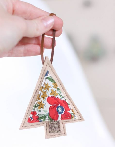 Add something special to your tree-trimming tradition with one of these DIY Christmas Ornaments! 🎄✨ DIY Christmas ornaments for every style. From minimal to modern, here are our favorite tree ornament tutorials to get you inspired. 🌟 #DIYOrnaments #HandmadeHolidays #ChristmasCrafts Ideas Decoracion Navidad, Sewing Christmas, Diy Tree Decor, Tiny Tree, Fabric Tree, Fabric Christmas Trees, Quilted Christmas Ornaments, Ultimate Christmas, Ornament Tutorial