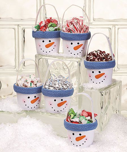 Cute holiday gift idea- these would be easy to make with flower pots or a tin/pail, paint and fleece to go around rim. You could even put the person or family's name around the rim if you desire!                                                                                                                                                      More Snowman Treats, Flower Pot Crafts, Clay Pot Crafts, Snowman Crafts, Christmas Goodies, Noel Christmas, Christmas Crafts For Kids, Winter Crafts, Xmas Crafts