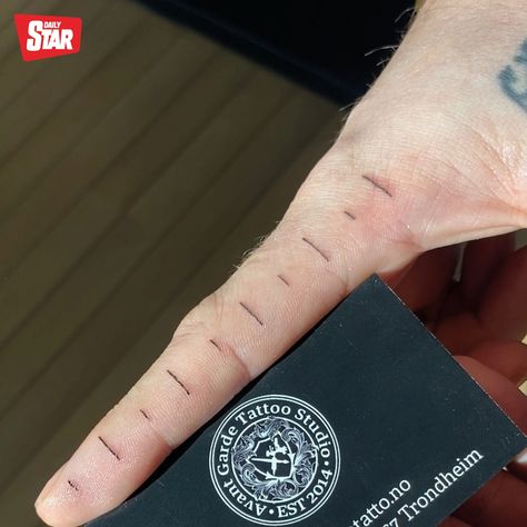 A man has found a "handy" way to help measure things using just his finger – a tattoo of a ruler. Steffen Karlsen, 31, asked his partner Julie Strmsnes, 35, to design the quirky inking on his right index finger. After a little persuasion, tattoo artist Julie inked the design onto his finger. She created it by drawing 10 lines 1cm apart from each other. Steffen admits he "loves" his tattoo, and it's since been branded "genius" by some social media users. He's more than happy that he can mak... Ruler Finger Tattoo, Ruler Tattoo Finger, Sticky Fingers Tattoo, Finger Ruler Tattoo, Ruler Tattoo, Crossing Fingers Tattoo, Weird Finger Tattoos, Finger Tattoo For Men, Quirky Tattoos