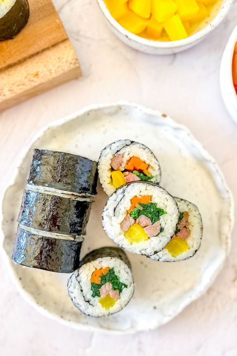 Classic Kimbap (Korean Seaweed Rice Roll) Korean Kimbap, Seaweed Rice, Rice Meat, Roasted Seaweed, Igloo Cooler, Pickled Radishes, Protein Nutrition, Marinated Beef, Packed Lunch