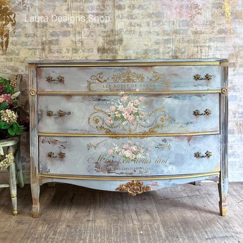 Make your furniture feel fancy with the Kacha Les Roses rub on transfer for furniture and crafting! This furniture transfer features oh-so-pretty French script and intricate scroll work in gold with bouquets of colorful pink roses. Add some je ne sais quoi to any surface with style and ease! Easily transform your project into a professional-looking work-of-art. No water needed; no prepping needed. Use it on any smooth surface, dressers, mirrors, cabinets, doors, or canvas and fabric. The possibi Furniture Transfers Vintage, Lace Painted Furniture, Transfers On Furniture, Kacha Furniture, Diy Decoupage Furniture, Dressers Mirrors, French Provincial Bedroom Furniture, Decoupaged Furniture, Rub On Transfers For Furniture