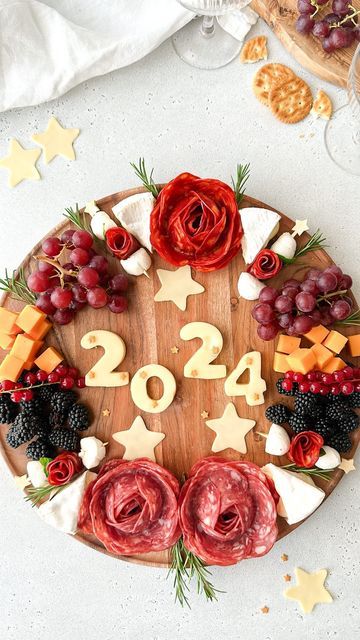 Kristel Talie on Instagram: "New Year’s Day is calling☎️ save this charcuterie sharing board for NYE🥂 Shopping list Salami slices Chorizo slices Camembert Cheddar cheese Mozzarella mini balls Red grapes Blackberries Red currants Emmental cheese Rosemary sprigs Star sprinkles Enjoy!✨ #nye #charcuterieboard #cheeseboard #appetizers #holidayrecipes" Emmental Cheese, Red Currants, Cheese Mozzarella, Star Sprinkles, Rosemary Sprigs, Red Currant, Red Grapes, Sharing Board, Finger Food