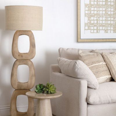 Illuminate your home with the warm glow of the Kelvin Floor Lamp. This lamp features a sturdy wood base paired with a natural jute shade, creating a perfect balance between rustic charm and contemporary design. The natural brown finish of the wood complements any room's color scheme, making it a versatile lighting solution. Ideal for reading corners, living rooms, or bedrooms, the Kelvin Floor Lamp enhances the ambiance of your space with its soft, diffused light. | Orren Ellis Kazir 62" Novelty Jute Shades, Coastal Flooring, Novelty Floor Lamp, Dovetail Furniture, Reading Corners, Tall Floor Lamps, Wood Floor Lamp, Floor Lamps Living Room, Contemporary Floor Lamps