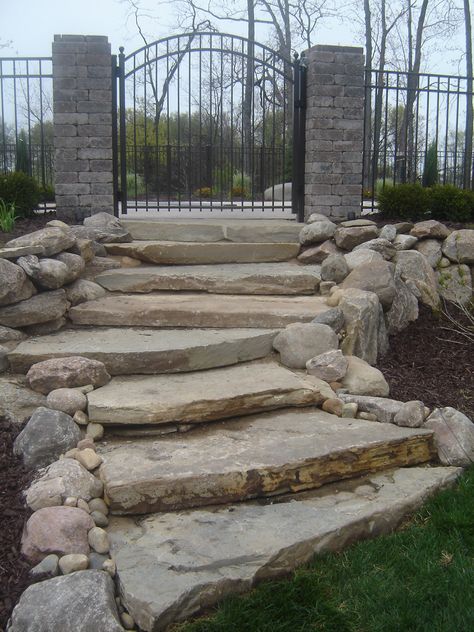 Hill Landscaping Ideas Backyard, Yard Hill Landscaping, Front Yard Hill Landscaping, Rock Stairs Outdoor, Hill Landscaping Ideas, Gated Pool, Stone Steps In Grass Slope, Pool Entrance, Stone Garden Stairs On A Slope