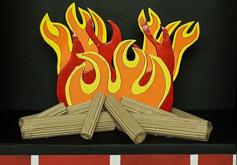 Creating fire and logs for a cardboard fireplace Make A Fireplace, Fireplace For Christmas, Fake Fire, Cardboard Fireplace, Christmas Door Decorating Contest, Door Decorating Contest, Fireplace Shelves, Winter Window, Brick Wallpaper