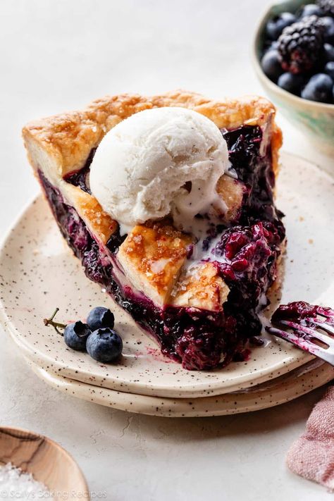 Blueberries, raspberries, and blackberries mingle to make a jammy filling in this triple berry pie, layered between 2 buttery, flaky crusts. Braided Pie Crust, Peach Crumble Pie, Berry Pie Filling, Berry Pie Recipe, Triple Berry Pie, Lattice Pie Crust, Homemade Blueberry Pie, Pie Crust Designs, Handle The Heat