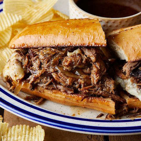 Slow Cooker French Dip Sandwiches feature tender beef cooked in a savory blend of beef broth, red wine, worcestershire, and herbs. Served on toasted rolls with melted cheese, these sandwiches are to die for. The slow cooking process ensures the beef is falling apart and creates a rich au jus sauce as the roast cooks. Au Jus Sauce, Slow Cooker French Dip Sandwiches, Jus Sauce, French Dip Sandwich Crockpot, Slow Cooker French Dip, Hamburger Helper Recipes, French Dip Sandwiches, Beef Dip, Dip Sandwiches